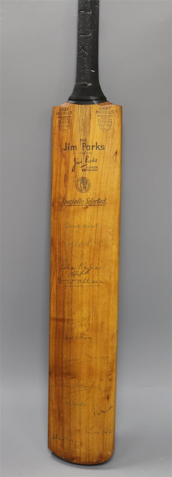A 1963 England V West Indies test series signed cricket bat and a cricket interest scrap book